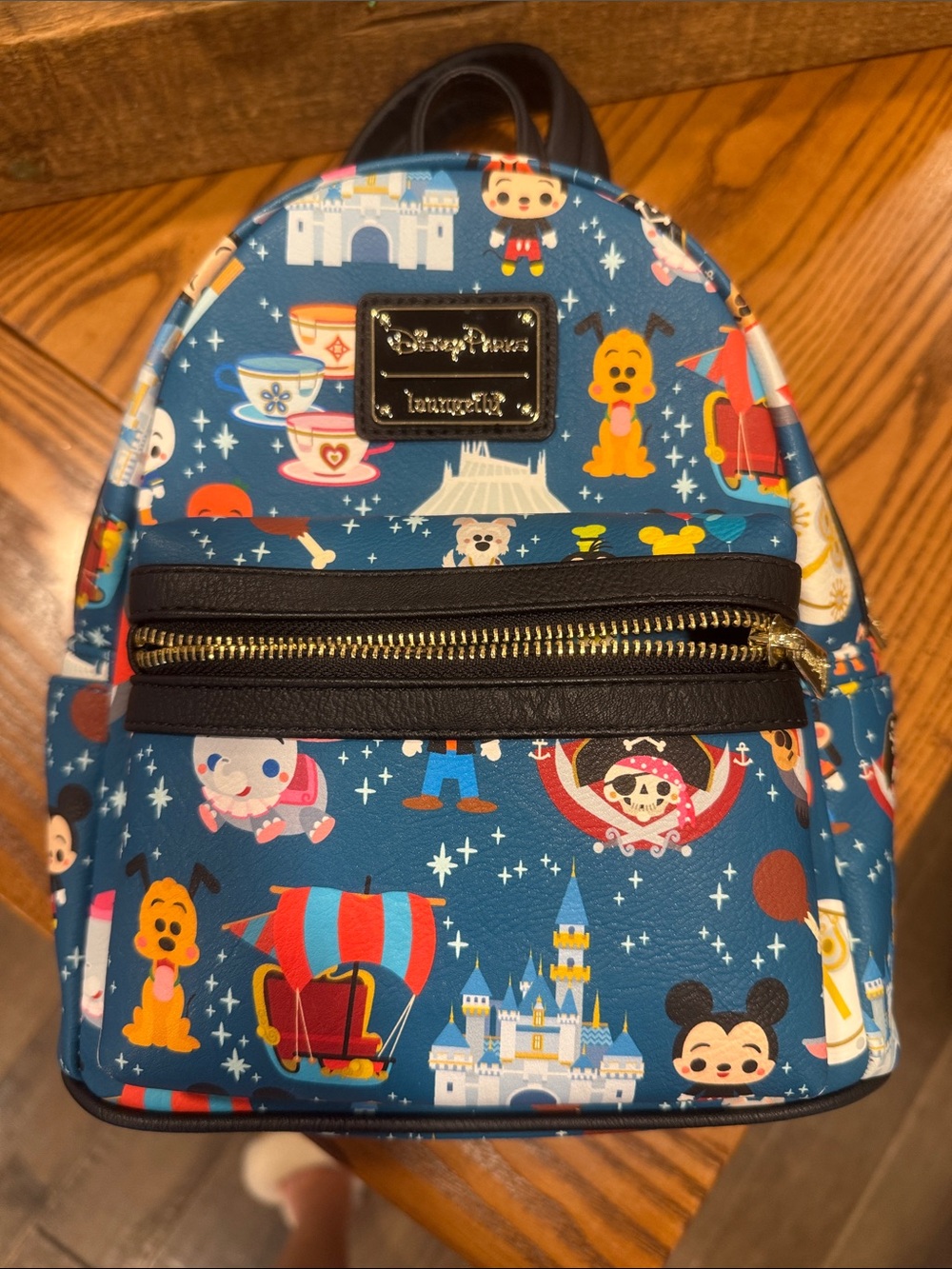 Loungefly Blue Mini Backpack with Colorful Theme Park Character Print